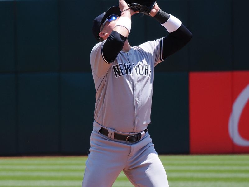 Jun 29, 2023; Oakland, California, USA; New York Yankees third baseman Josh Donaldson (28) catches the ball against the Oakland Athletics during the first inning at Oakland-Alameda County Coliseum. Mandatory Credit: Kelley L Cox-USA TODAY Sports