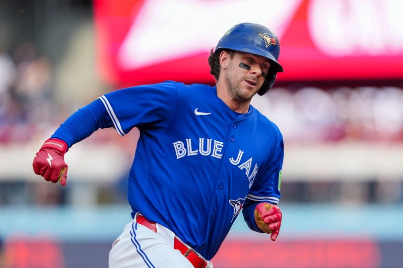 Sep 27, 2025; Toronto, Ontario, CAN; Toronto Blue Jays third base Ernie Clement (22) turns third against the Tampa Bay Rays during the fifth inning at Rogers Centre. Mandatory Credit: Kevin Sousa-Imagn Images