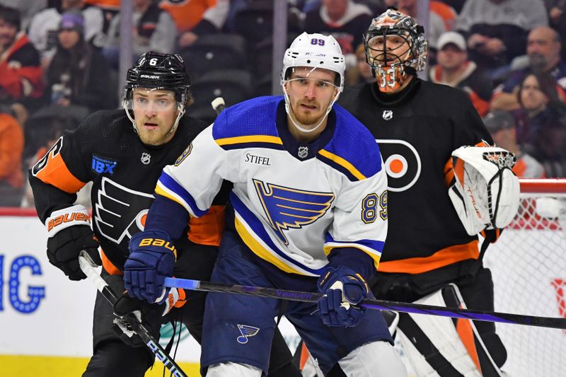 Mar 4, 2024; Philadelphia, Pennsylvania, USA; Philadelphia Flyers defenseman Travis Sanheim (6) battles with St. Louis Blues left wing Pavel Buchnevich (89) in front of goaltender Samuel Ersson (33) during the first period at Wells Fargo Center. Mandatory Credit: Eric Hartline-USA TODAY Sports