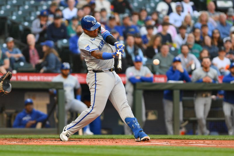 May 14, 2024; Seattle, Washington, USA; Kansas City Royals catcher Salvador Perez (13) hits a single against the Seattle Mariners during the second inning at T-Mobile Park. Mandatory Credit: Steven Bisig-USA TODAY Sports