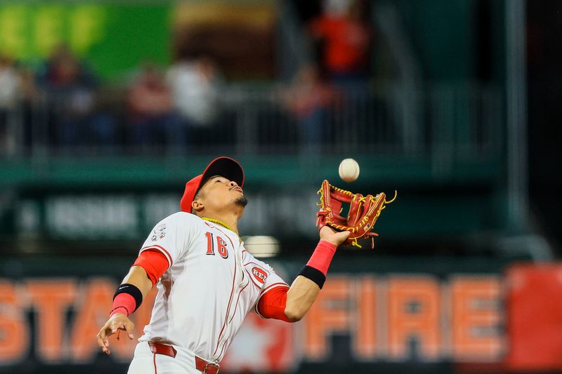 Sep 17, 2024; Cincinnati, Ohio, USA; Cincinnati Reds third baseman Noelvi Marte (16) catches a pop up hit by Atlanta Braves first baseman Matt Olson (not pictured) in the fourth inning at Great American Ball Park. Mandatory Credit: Katie Stratman-Imagn Images