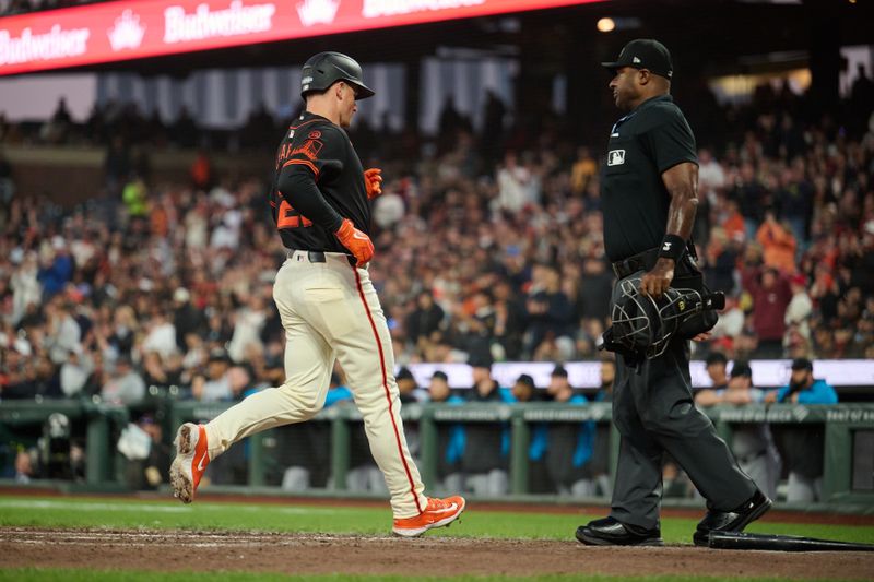 Aug 31, 2024; San Francisco, California, USA; San Francisco Giants infielder Matt Chapman (26) scores a run on an RBI single by infielder Tyler Fitzgerald (49) (not pictured) against the Miami Marlins during the sixth inning at Oracle Park. Mandatory Credit: Robert Edwards-USA TODAY Sports