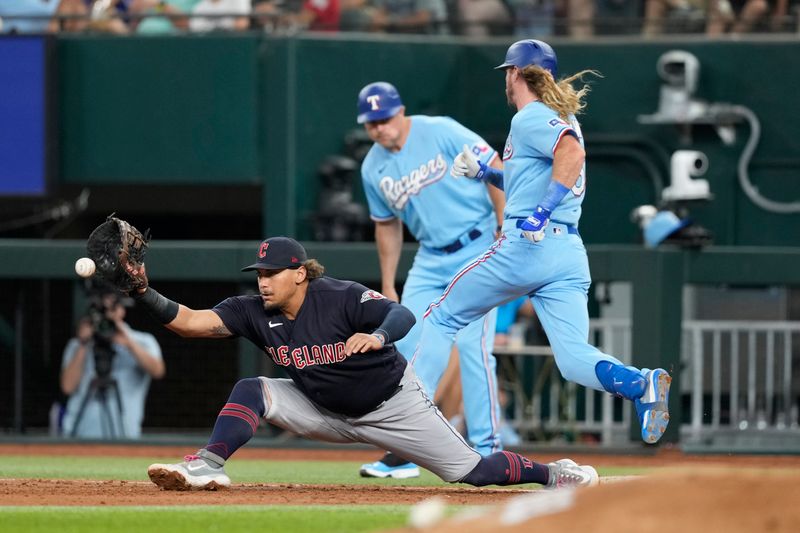 Jul 16, 2023; Arlington, Texas, USA; Texas Rangers left fielder Travis Jankowski (16) singles ahead of the throw to Cleveland Guardians first baseman Josh Naylor (22) during the secnond inning at Globe Life Field. Mandatory Credit: Jim Cowsert-USA TODAY Sports