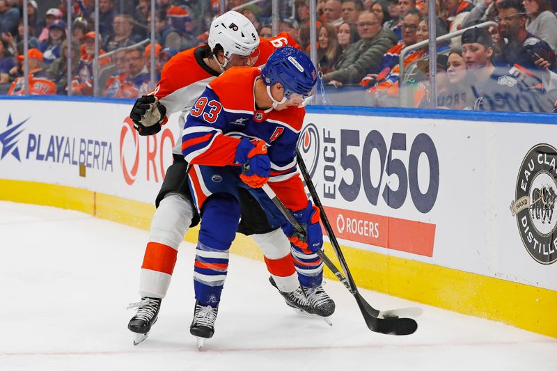 Oct 15, 2024; Edmonton, Alberta, CAN; Edmonton Oilers forward Ryan Nugent-Hopkins (93) and Philadelphia Flyers defensemen Jamie Drysdale (9) battle for the puck during the third period at Rogers Place. Mandatory Credit: Perry Nelson-Imagn Images