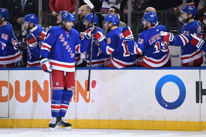 Dec 22, 2023; New York, New York, USA;  New York Rangers right wing Blake Wheeler (17) celebrates his goal against the Edmonton Oilers with the New York Rangers bench during the first period at Madison Square Garden. Mandatory Credit: Dennis Schneidler-USA TODAY Sports