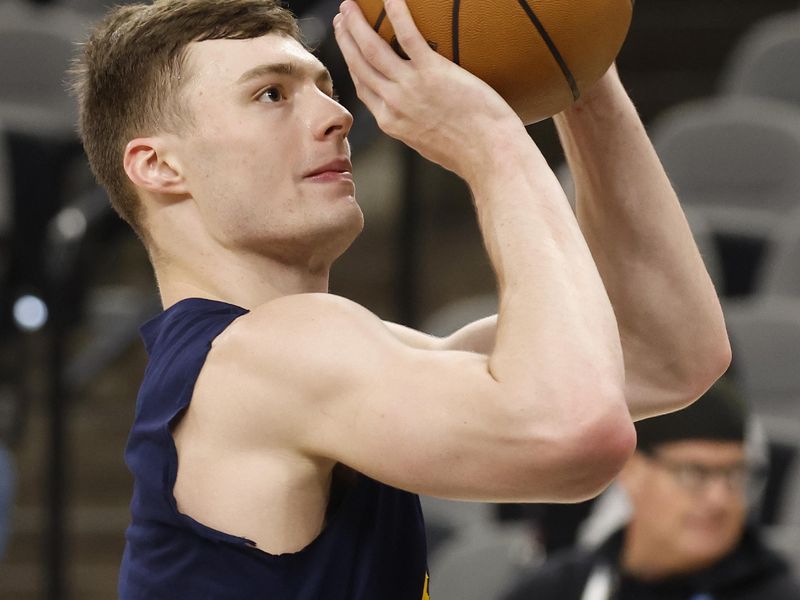 SAN ANTONIO, TX - APRIL 12:  Christian Braun #0 of the Denver Nuggets takes warm-up shots before their game against the San Antonio Spurs at Frost Bank Center on April 12, 2024 in San Antonio, Texas. NOTE TO USER: User expressly acknowledges and agrees that, by downloading and or using this photograph, User is consenting to terms and conditions of the Getty Images License Agreement. (Photo by Ronald Cortes/Getty Images)