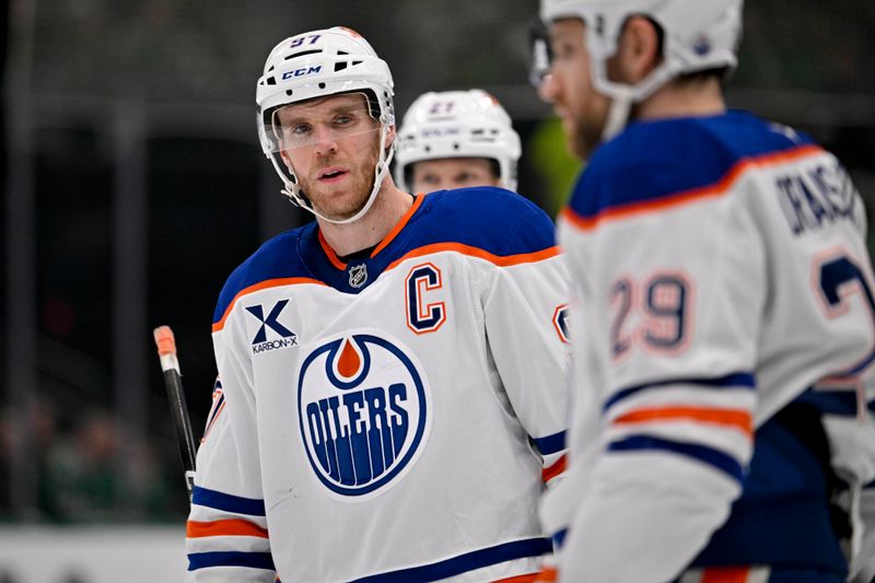 Nov 4, 2025; Dallas, Texas, USA; Edmonton Oilers center Connor McDavid (97) and center Leon Draisaitl (29) prepare to go on the power play against the Dallas Stars during the first period at the American Airlines Center. Mandatory Credit: Jerome Miron-Imagn Images
