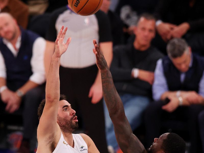 NEW YORK, NEW YORK - NOVEMBER 01: Georges Niang #20 of the Cleveland Cavaliers drives to the net against Julius Randle #30 of the New York Knicks in the second half at Madison Square Garden on November 01, 2023 in New York City. NOTE TO USER: User expressly acknowledges and agrees that, by downloading and or using this photograph, User is consenting to the terms and conditions of the Getty Images License Agreement. Mandatory Copyright Notice: Copyright 2023 NBAE (Photo by Mike Stobe/Getty Images)