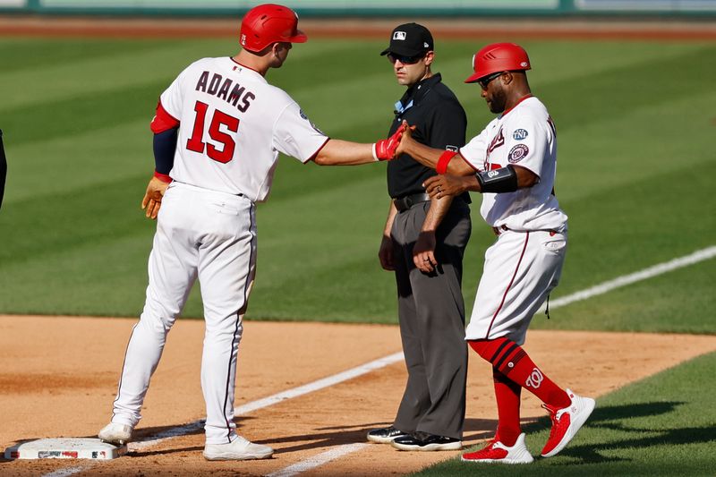 Aug 17, 2023; Washington, District of Columbia, USA; Washington Nationals catcher Riley Adams (15) celebrates with Nationals first base coach Eric Young Jr. (12) after hitting a two run single against the Boston Red Sox during the fifth inning at Nationals Park. Mandatory Credit: Geoff Burke-USA TODAY Sports