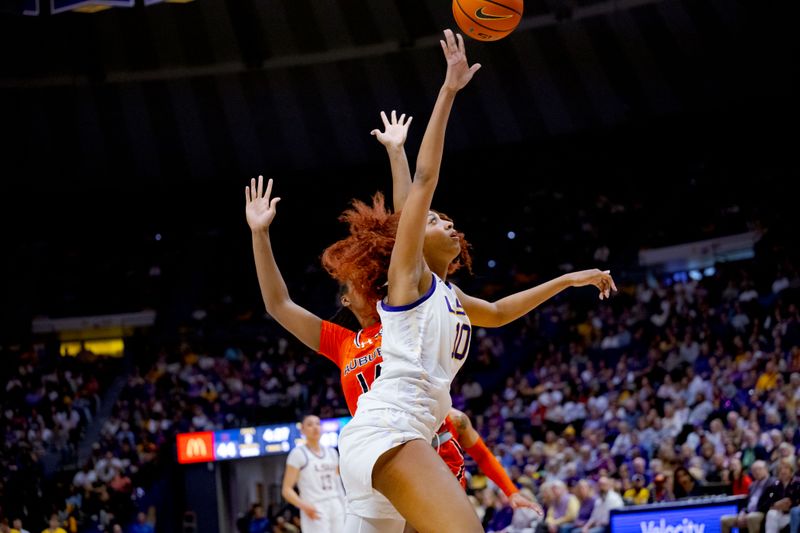 Feb 22, 2024; Baton Rouge, Louisiana, USA; LSU Lady Tigers forward Angel Reese (10) shoots against Auburn Tigers forward Taylen Collins (14) during the second half at Pete Maravich Assembly Center. Mandatory Credit: Matthew Hinton-USA TODAY Sports