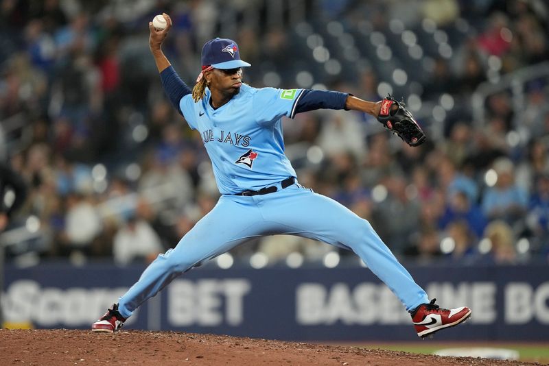 May 29, 2025; Toronto, Ontario, CAN; Toronto Blue Jays pitcher Jose Urena (48) pitches to the Athletics during the eighth inning at Rogers Centre. Mandatory Credit: John E. Sokolowski-Imagn Images