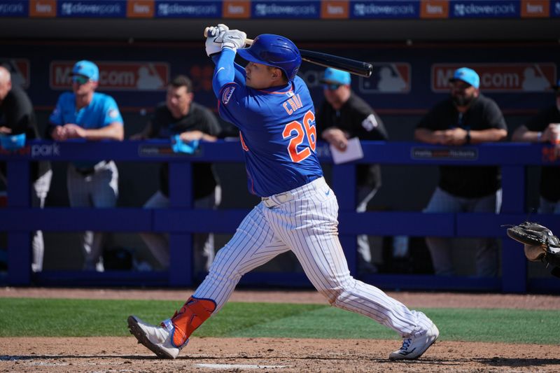 Feb 27, 2024; Port St. Lucie, Florida, USA;  New York Mets first baseman Ji-Man Choi (26) hits a solo home run in the sixth inning against the Miami Marlins at Clover Park. Mandatory Credit: Jim Rassol-USA TODAY Sports