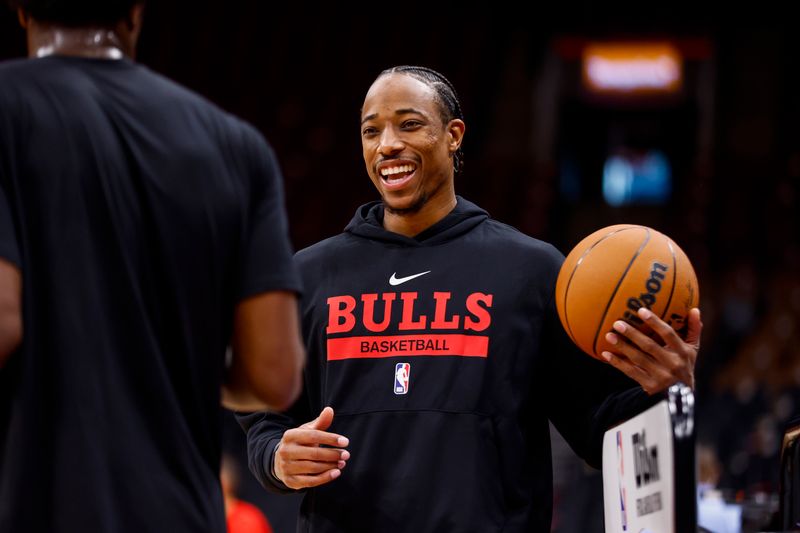 TORONTO, CANADA - OCTOBER 9: DeMar DeRozan #11 of the Chicago Bulls smiles before a preseason game on October 9, 2022 at the Scotiabank Arena in Toronto, Ontario, Canada.  NOTE TO USER: User expressly acknowledges and agrees that, by downloading and or using this Photograph, user is consenting to the terms and conditions of the Getty Images License Agreement.  Mandatory Copyright Notice: Copyright 2022 NBAE (Photo by Vaughn Ridley/NBAE via Getty Images)