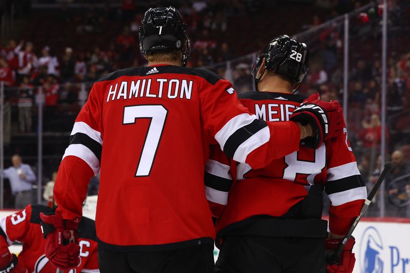 Sep 25, 2023; Newark, New Jersey, USA; New Jersey Devils defenseman Dougie Hamilton (7) and left wing Timo Meier (28) celebrate Meier   s goal against the Philadelphia Flyers during the second period at Prudential Center. Mandatory Credit: Ed Mulholland-USA TODAY Sports