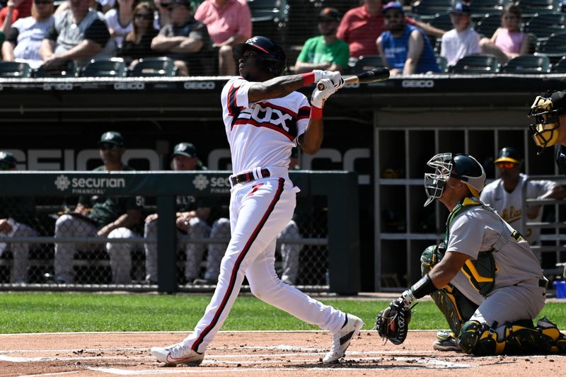 Aug 27, 2023; Chicago, Illinois, USA;  Chicago White Sox shortstop Tim Anderson (7) hits a double against the Oakland Athletics during the first inning at Guaranteed Rate Field. Mandatory Credit: Matt Marton-USA TODAY Sports