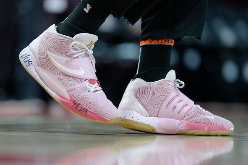 PORTLAND, OREGON - FEBRUARY 27: A general view of the sneakers worn by Caleb Martin #16 of the Miami Heat prior to a game against the Portland Trail Blazers at Moda Center on February 27, 2024 in Portland, Oregon. NOTE TO USER: User expressly acknowledges and agrees that, by downloading and or using this photograph, User is consenting to the terms and conditions of the Getty Images License Agreement. (Photo by Soobum Im/Getty Images)