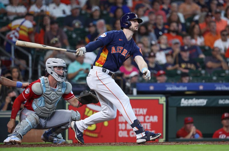 Jun 18, 2023; Houston, Texas, USA; Houston Astros right fielder Kyle Tucker (30) hits an RBI double during the first inning against the Cincinnati Reds at Minute Maid Park. Mandatory Credit: Troy Taormina-USA TODAY Sports