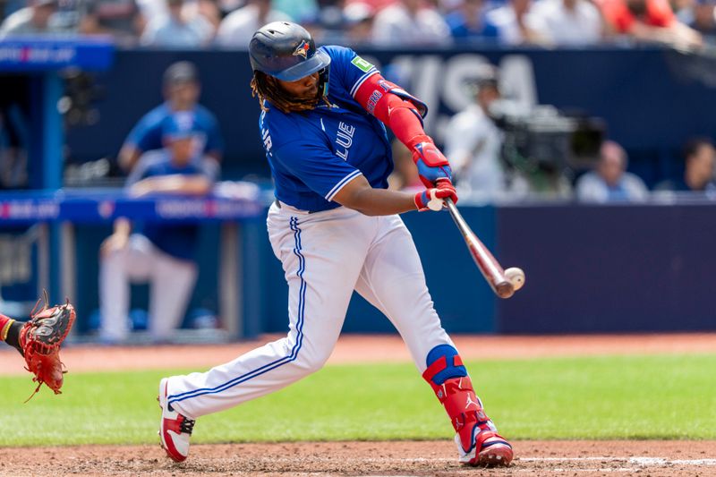 Aug 13, 2023; Toronto, Ontario, CAN; Toronto Blue Jays first baseman Vladimir Guerrero Jr. (27) bats against the Chicago Cubs during the fifth inning at Rogers Centre. Mandatory Credit: Kevin Sousa-USA TODAY Sports