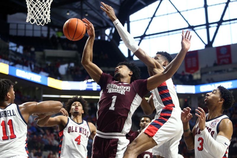 Feb 18, 2023; Oxford, Mississippi, USA; Mississippi State Bulldogs forward Tolu Smith (1) and Mississippi Rebels forward Theo Akwuba (10) battle for a rebound during the first half at The Sandy and John Black Pavilion at Ole Miss. Mandatory Credit: Petre Thomas-USA TODAY Sports