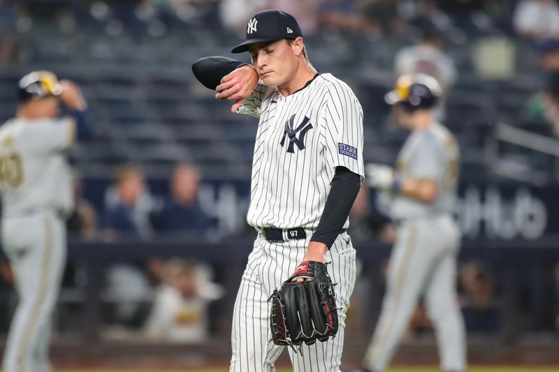 Sep 9, 2023; Bronx, New York, USA;  New York Yankees relief pitcher Ron Marinaccio (97) walks off the mound in the ninth inning against the Milwaukee Brewers at Yankee Stadium. Mandatory Credit: Wendell Cruz-USA TODAY Sports