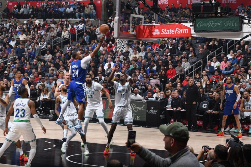 LOS ANGELES, CA - FEBRUARY 12:  Norman Powell #24 of the LA Clippers goes to the basket during the game on February 12, 2024 at Crypto.Com Arena in Los Angeles, California. NOTE TO USER: User expressly acknowledges and agrees that, by downloading and/or using this Photograph, user is consenting to the terms and conditions of the Getty Images License Agreement. Mandatory Copyright Notice: Copyright 2024 NBAE (Photo by Adam Pantozzi/NBAE via Getty Images)