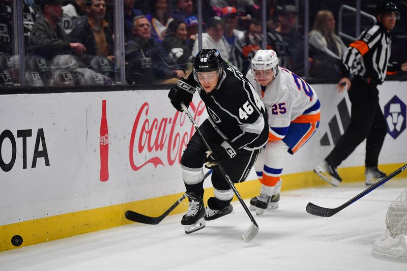 Mar 11, 2024; Los Angeles, California, USA; Los Angeles Kings center Blake Lizotte (46) plays for the puck against New York Islanders defenseman Sebastian Aho (25) during the second period at Crypto.com Arena. Mandatory Credit: Gary A. Vasquez-USA TODAY Sports