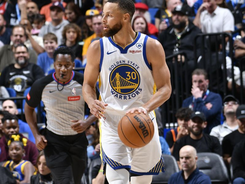 ORLANDO, FL - MARCH 27: Stephen Curry #30 of the Golden State Warriors handles the ball during the game against the Orlando Magic on March 27, 2024 at Amway Center in Orlando, Florida. NOTE TO USER: User expressly acknowledges and agrees that, by downloading and or using this photograph, User is consenting to the terms and conditions of the Getty Images License Agreement. Mandatory Copyright Notice: Copyright 2024 NBAE (Photo by Fernando Medina/NBAE via Getty Images)