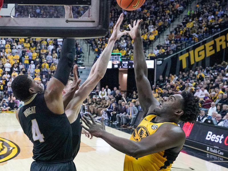 Jan 7, 2023; Columbia, Missouri, USA; Missouri Tigers guard Kobe Brown (24) shoots as Vanderbilt Commodores guard Jordan Wright (4) defends during the first half at Mizzou Arena. Mandatory Credit: Denny Medley-USA TODAY Sports