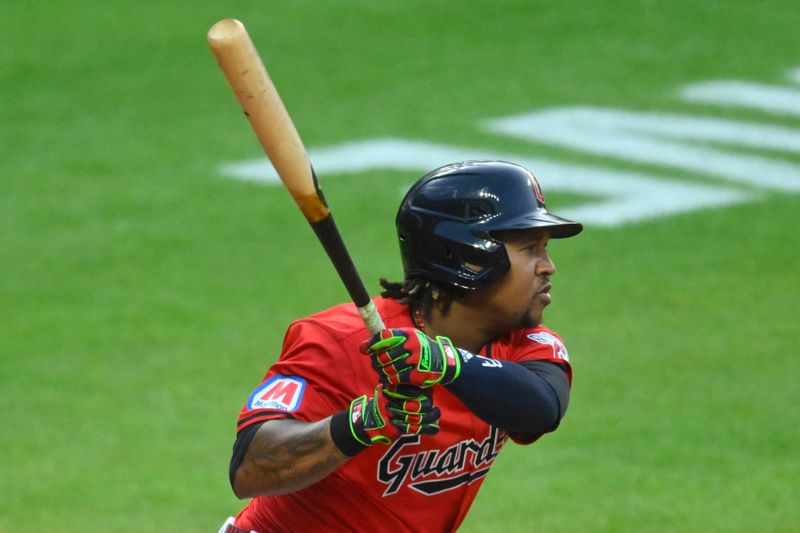 Jul 23, 2024; Cleveland, Ohio, USA; Cleveland Guardians third baseman Jose Ramirez (11) hits an RBI single in the sixth inning against the Detroit Tigers at Progressive Field. Mandatory Credit: David Richard-USA TODAY Sports