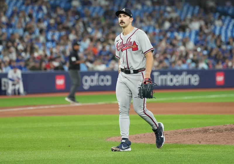 May 12, 2023; Toronto, Ontario, CAN; Atlanta Braves starting pitcher Spencer Strider (99) walks towards the dugout after being relieved  during the seventh inning against the Toronto Blue Jays at Rogers Centre. Mandatory Credit: Nick Turchiaro-USA TODAY Sports