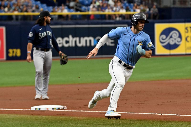 Sep 10, 2023; St. Petersburg, Florida, USA; Tampa Bay Rays second baseman Brandon Lowe (8) rounds third base on the way to scoring a run in the first inning against the Seattle Mariners  at Tropicana Field. Mandatory Credit: Jonathan Dyer-USA TODAY Sports