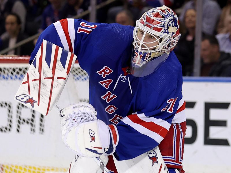 Mar 26, 2024; New York, New York, USA; New York Rangers goaltender Igor Shesterkin (31) plays the puck against the Philadelphia Flyers during the second period at Madison Square Garden. Mandatory Credit: Brad Penner-USA TODAY Sports