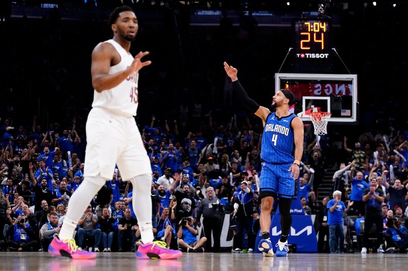 ORLANDO, FLORIDA - APRIL 25: Jalen Suggs #4 of the Orlando Magic celebrates scoring a three-pointer against the Cleveland Cavaliers during the first quarter of game three of the Eastern Conference First Round Playoffs at Kia Center on April 25, 2024 in Orlando, Florida. NOTE TO USER: User expressly acknowledges and agrees that, by downloading and or using this photograph, User is consenting to the terms and conditions of the Getty Images License Agreement. (Photo by Rich Storry/Getty Images)