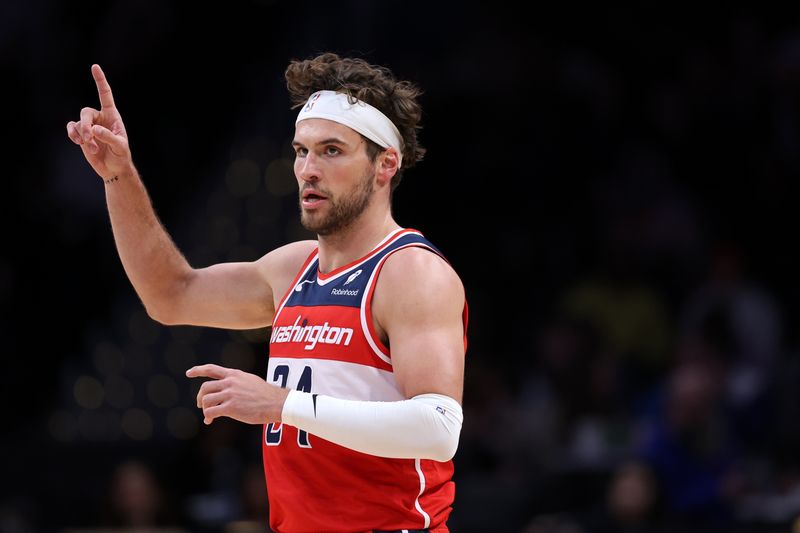 WASHINGTON, DC - MARCH 06: Corey Kispert #24 of the Washington Wizards celebrates against the Orlando Magic during the first half at Capital One Arena on March 06, 2024 in Washington, DC. NOTE TO USER: User expressly acknowledges and agrees that, by downloading and or using this photograph, User is consenting to the terms and conditions of the Getty Images License Agreement. (Photo by Patrick Smith/Getty Images)