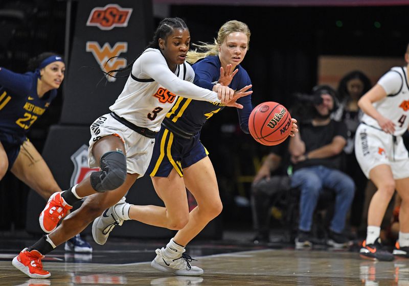 Mar 10, 2023; Kansas City, MO, USA;  Oklahoma State Cowgirls guard Naomie Alnatas (3) goes after a loose ball with West Virginia Mountaineers guard Danni Nichols (4) during the first half at Municipal Auditorium. Mandatory Credit: Peter Aiken-USA TODAY Sports