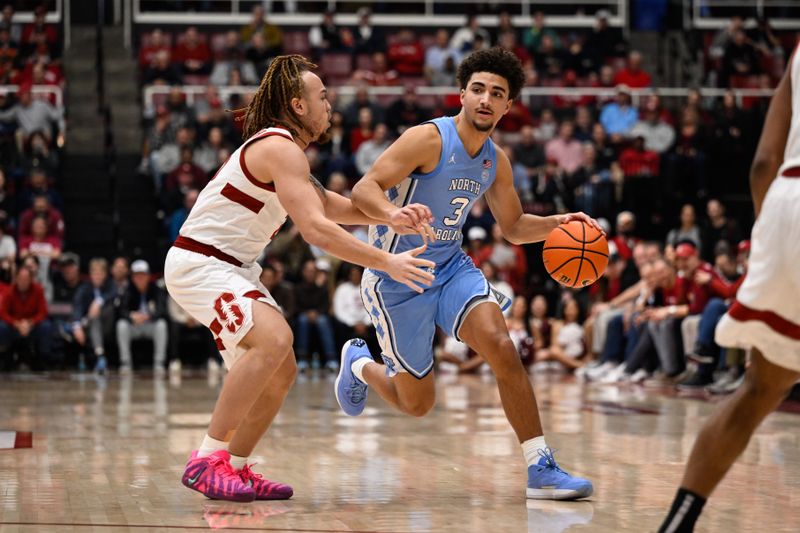 Jan 14, 2026; Stanford, California, USA; North Carolina Tar Heels guard Derek Dixon (3) dribbles against Stanford Cardinal guard Jeremy Dent-Smith (25) in the second half at Maples Pavilion. Mandatory Credit: Eakin Howard-Imagn Images
