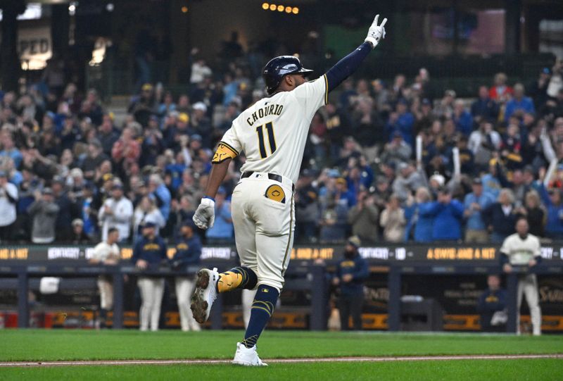 Apr 3, 2024; Milwaukee, Wisconsin, USA; Milwaukee Brewers right fielder Jackson Chourio (11) celebrates after hitting his first Major League home run against the Minnesota Twins in the fifth inning at American Family Field. Mandatory Credit: Michael McLoone-USA TODAY Sports