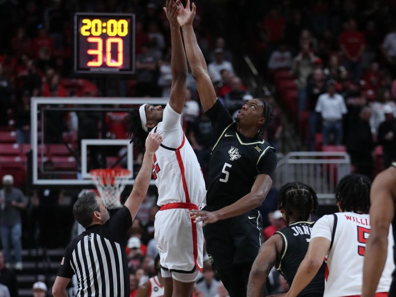 Feb 10, 2024; Lubbock, Texas, USA; Central Florida Knights forward Omar Payne (5) and Texas Tech Red Raiders forward Warren Washington (22) vie for the opening tip at United Supermarkets Arena. Mandatory Credit: Michael C. Johnson-USA TODAY Sports