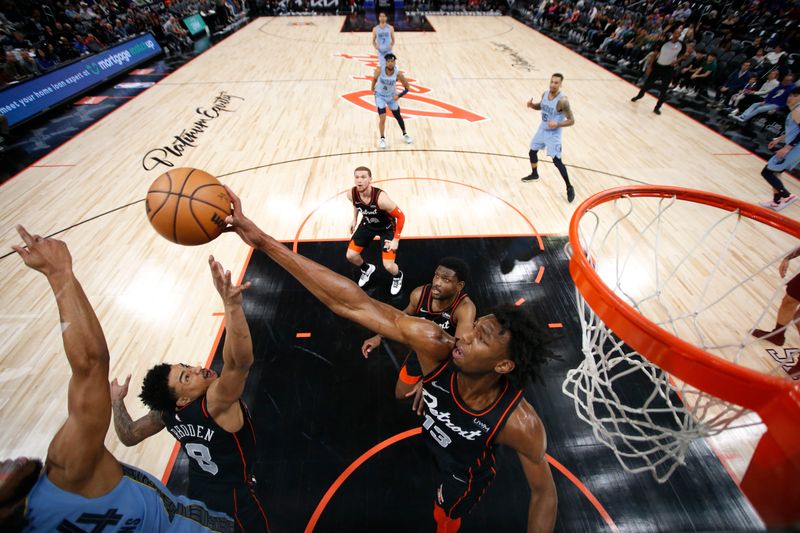 DETROIT, MI - APRIL 1: James Wiseman #13 of the Detroit Pistons blocks the ball during the game against the Memphis Grizzlies on April 1, 2024 at Little Caesars Arena in Detroit, Michigan. NOTE TO USER: User expressly acknowledges and agrees that, by downloading and/or using this photograph, User is consenting to the terms and conditions of the Getty Images License Agreement. Mandatory Copyright Notice: Copyright 2024 NBAE (Photo by Brian Sevald/NBAE via Getty Images)