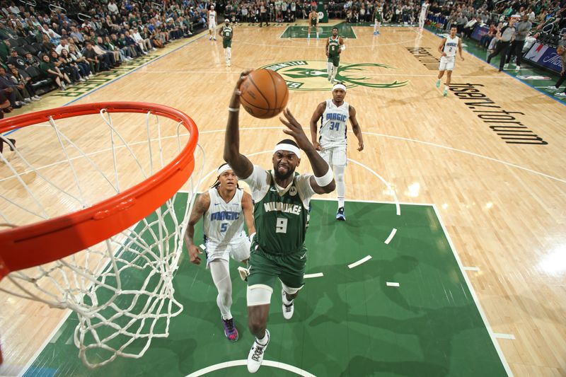 MILWAUKEE, WI - APRIL 10: Bobby Portis #9 of the Milwaukee Bucks dunks the ball during the game against the Orlando Magic on April 10, 2024 at the Fiserv Forum Center in Milwaukee, Wisconsin. NOTE TO USER: User expressly acknowledges and agrees that, by downloading and or using this Photograph, user is consenting to the terms and conditions of the Getty Images License Agreement. Mandatory Copyright Notice: Copyright 2024 NBAE (Photo by Gary Dineen/NBAE via Getty Images).