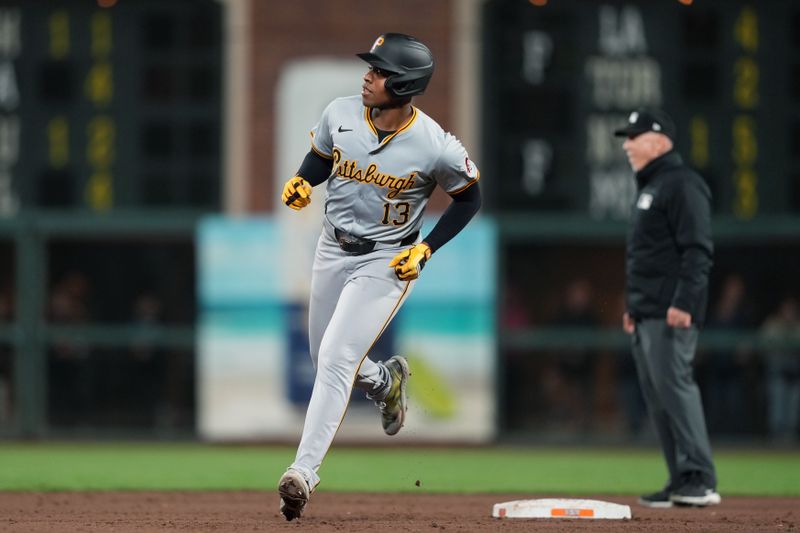 Apr 27, 2024; San Francisco, California, USA; Pittsburgh Pirates third baseman Ke'Bryan Hayes (13) rounds the bases after hitting a home run against the San Francisco Giants during the tenth inning at Oracle Park. Mandatory Credit: Darren Yamashita-USA TODAY Sports