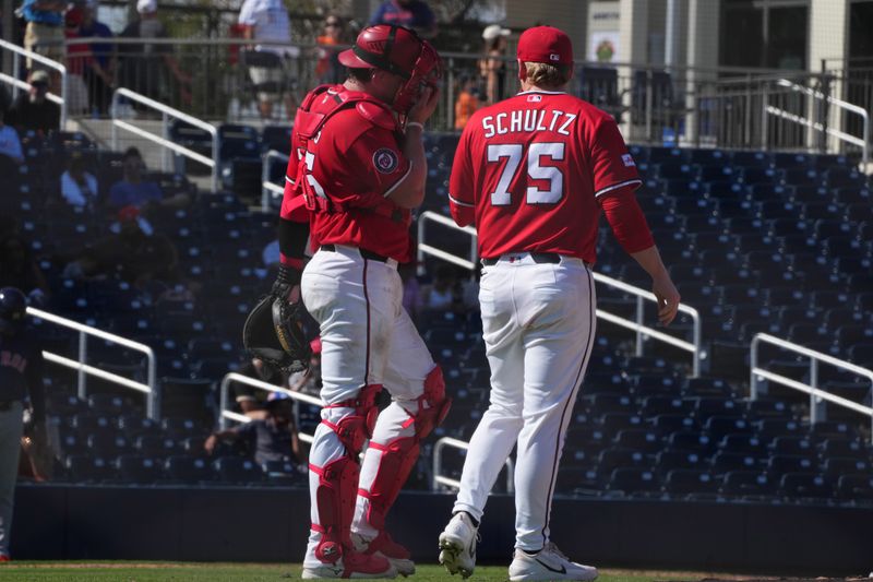 Feb 21, 2026; West Palm Beach, Florida, USA;  Washington Nationals catcher Riley Adams (15) talks with pitcher Paxton Schultz (75) in the fifth inning against the Houston Astros at CACTI Park of the Palm Beaches. Mandatory Credit: Jim Rassol-Imagn Images