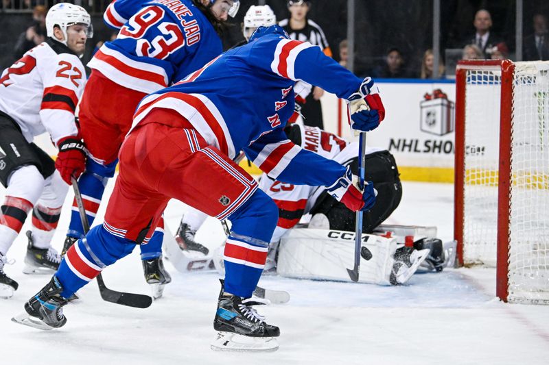 Dec 2, 2024; New York, New York, USA;  New York Rangers left wing Chris Kreider (20) scores a goal past New Jersey Devils goaltender Jacob Markstrom (25) during the second period at Madison Square Garden. Mandatory Credit: Dennis Schneidler-Imagn Images