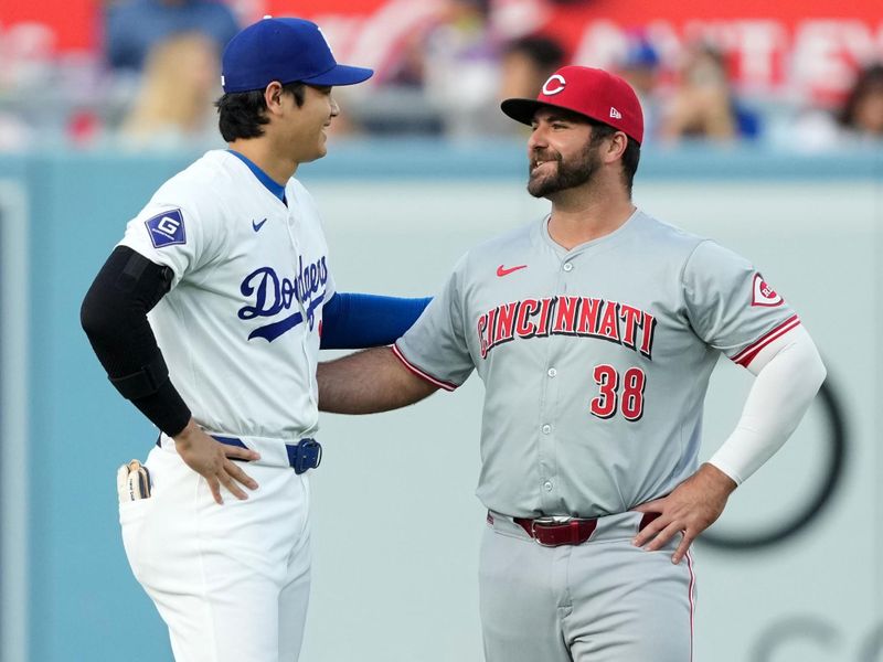 May 16, 2024; Los Angeles, California, USA; Los Angeles Dodgers designated hitter Shohei Ohtani (17) talks with Cincinnati Reds first baseman Mike Ford (38) during the game at Dodger Stadium. Mandatory Credit: Kirby Lee-USA TODAY Sports