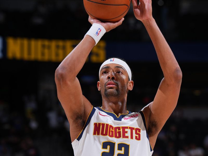 DENVER, CO - OCTOBER 13: Zeke Nnaji #22 of the Denver Nuggets shoots a free throw during the game against the Phoenix Suns on October 13, 2024 at Ball Arena in Denver, Colorado. NOTE TO USER: User expressly acknowledges and agrees that, by downloading and/or using this Photograph, user is consenting to the terms and conditions of the Getty Images License Agreement. Mandatory Copyright Notice: Copyright 2024 NBAE (Photo by Garrett Ellwood/NBAE via Getty Images)