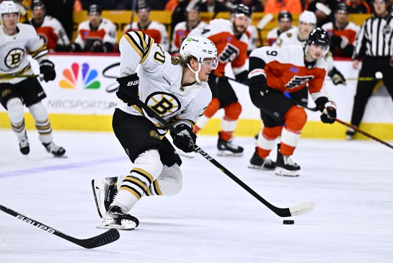 Jan 27, 2024; Philadelphia, Pennsylvania, USA; Boston Bruins center Jesper Boqvist (70) controls the puck against the Philadelphia Flyers in the first period at Wells Fargo Center. Mandatory Credit: Kyle Ross-USA TODAY Sports