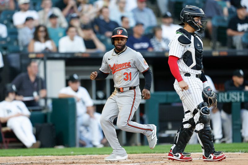 May 23, 2024; Chicago, Illinois, USA; Baltimore Orioles outfielder Cedric Mullins (31) scores against the Chicago White Sox during the third inning at Guaranteed Rate Field. Mandatory Credit: Kamil Krzaczynski-USA TODAY Sports