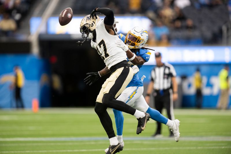 Los Angeles Chargers cornerback Ja'Sir Taylor (36) breaks a pass intended to New Orleans Saints wide receiver A.T. Perry (17) during an NFL preseason football game, Sunday, Aug. 20, 2023, in Inglewood, Calif. (AP Photo/Kyusung Gong)