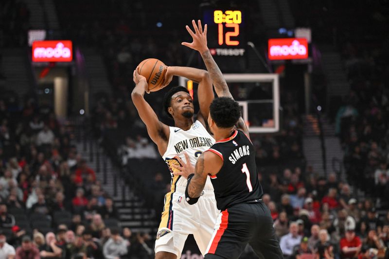 PORTLAND, OREGON - OCTOBER 25: Herbert Jones #2 of the New Orleans Pelicans looks to pass the ball against Anfernee Simons #1 of the Portland Trail Blazers during the first quarter of the game at Moda Center on October 25, 2024 in Portland, Oregon. NOTE TO USER: User expressly acknowledges and agrees that, by downloading and or using this photograph, User is consenting to the terms and conditions of the Getty Images License Agreement. (Photo by Alika Jenner/Getty Images)