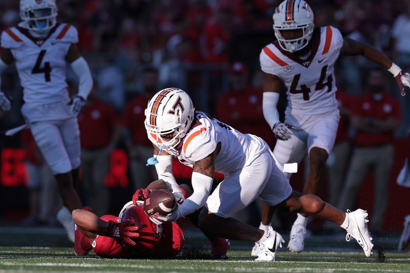 Sep 16, 2023; Piscataway, New Jersey, USA;  Virginia Tech Hokies cornerback Derrick Canteen (13) can not secure an interception on a pass intended for Rutgers Scarlet Knights wide receiver Ian Strong (29) during the second half at SHI Stadium. Mandatory Credit: Vincent Carchietta-USA TODAY Sports